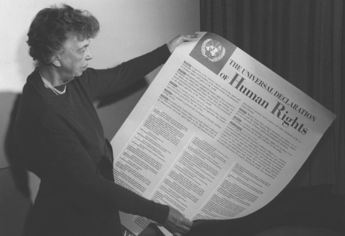 Eleanor Roosevelt holding the Declaration of Human Rights