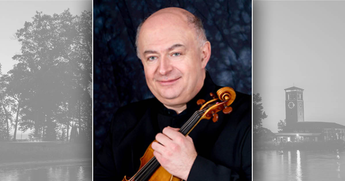 Ilya Kaler in a black suit holding a violin