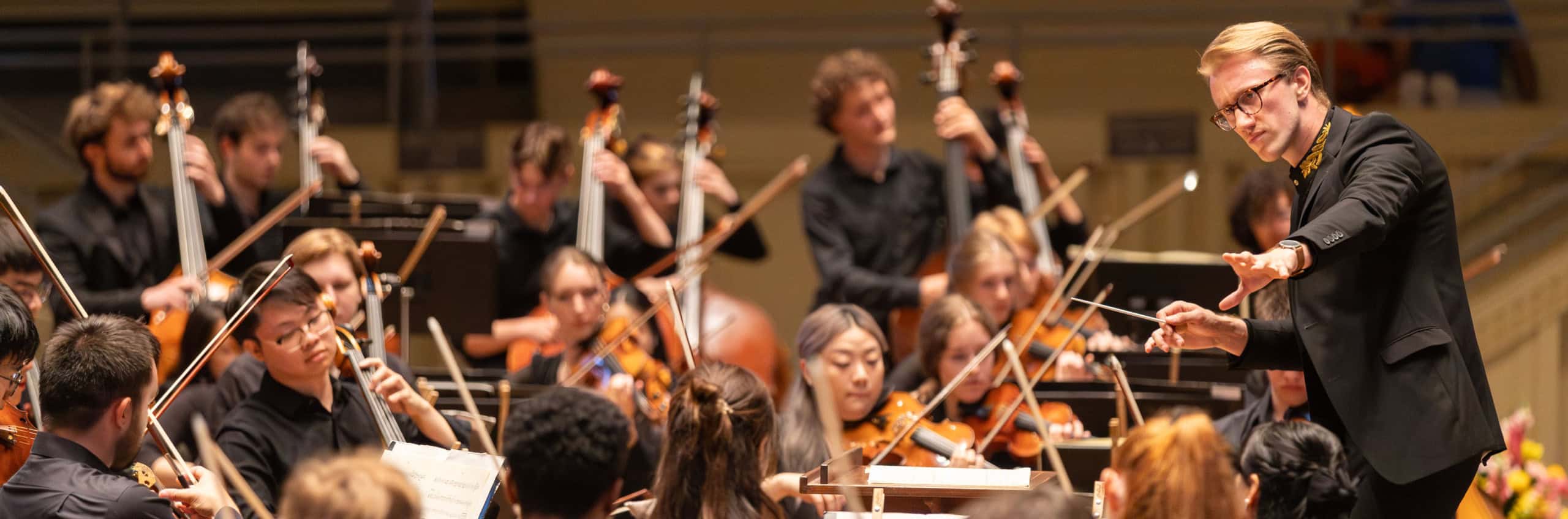 The 2024 conducting fellow conducting the Music School Festival Orchestra