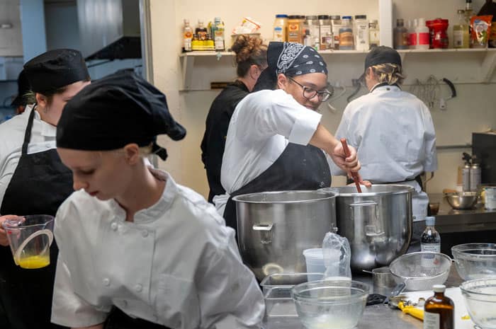 Pastry chefs working in the hotel kitchen