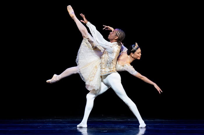 Two dancers on stage during a ballet performance