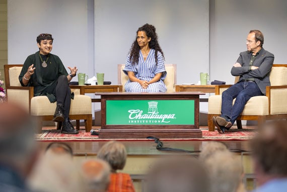 Three National Georgraphic explorers on stage in conversation