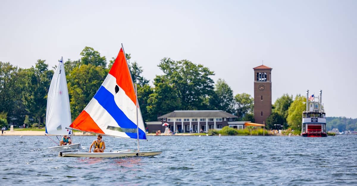 People sailing near the Miller Bell Tower