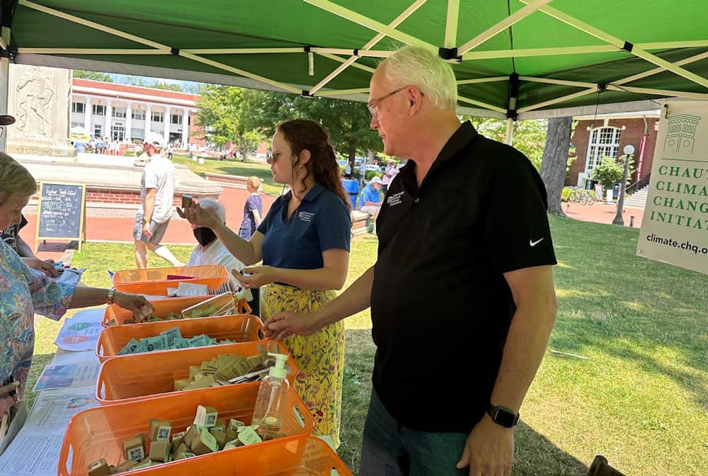 Volunteers giving out samples of Junk Free Skin hand wash and other sustainable products.