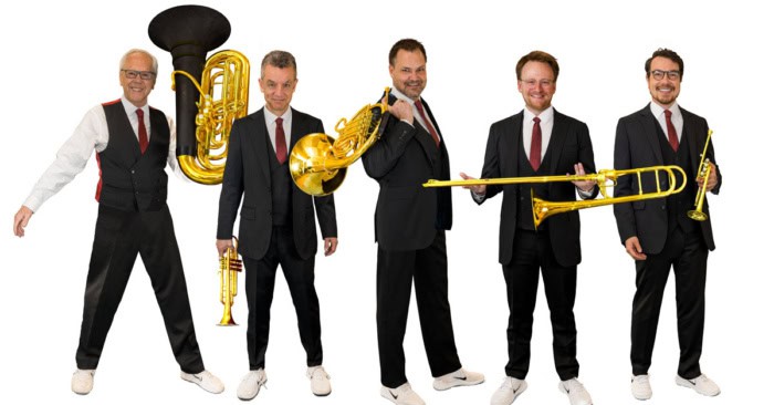 Canadian Brass members standing in black suits with their instruments